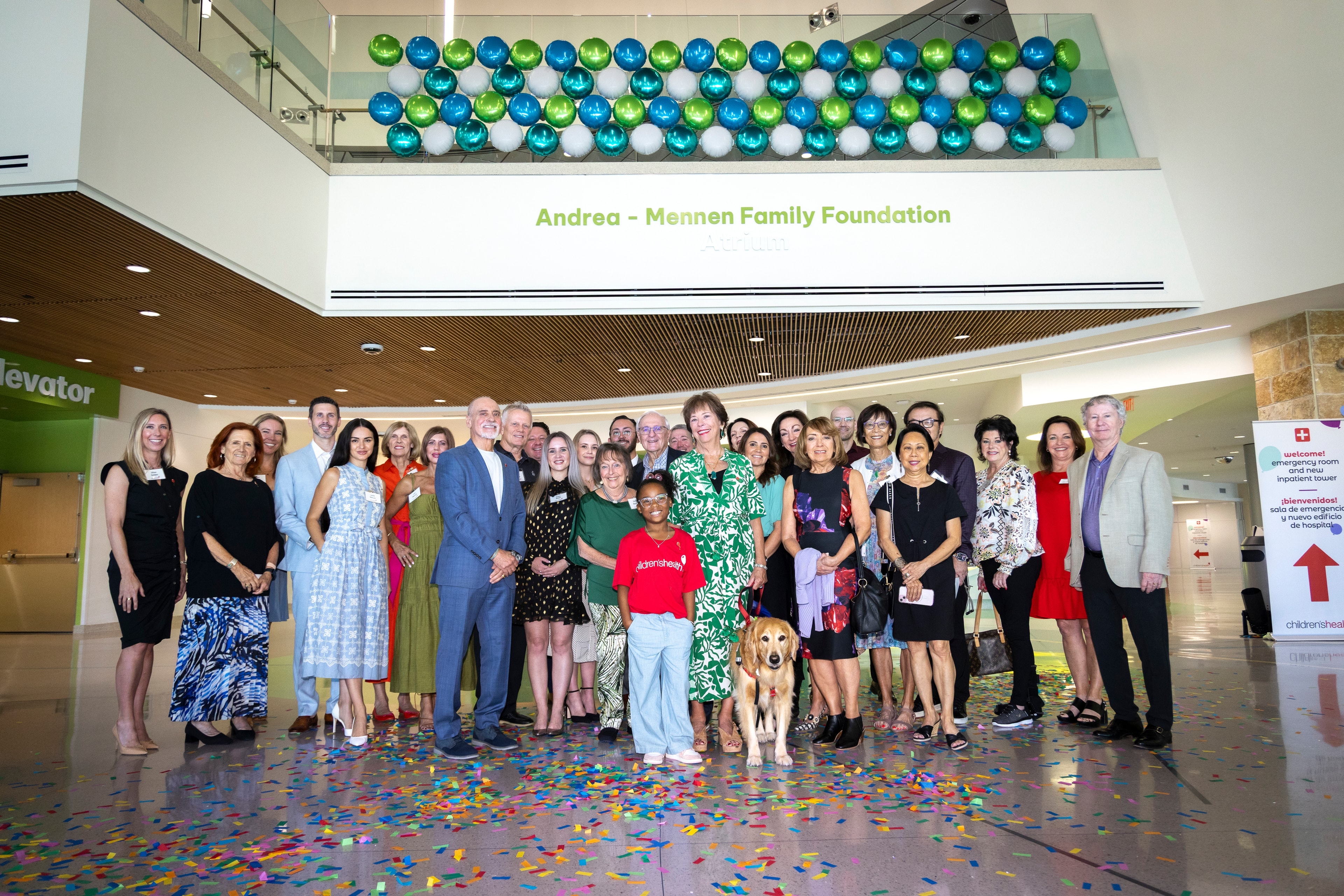 Large group gathered at the Andrea-Mennen Family Foundation atrium at Children's Health